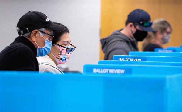 Voters cast their ballots at the Gwinnett County Department of Water Resources in Lawrenceville on Nov. 3. A study found that 49% of Georgia voters who cast ballots that day in the presidential election took time to review their printed ballots to check for errors. (Casey Sykes for The Atlanta-Journal Constitution)
