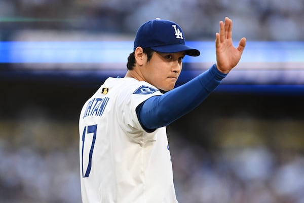 Los Angeles Dodgers starting pitcher Shohei Ohtani waves near the mound during the first inning of a baseball game against the San Diego Padres, Monday, June 16, 2025, in Los Angeles. (AP Photo/Kyusung Gong)