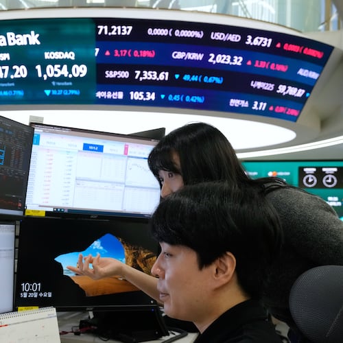 Currency traders watch monitors at the foreign exchange dealing room of the Hana Bank headquarters in Seoul, South Korea, Wednesday, May 20, 2026. (AP Photo/Ahn Young-joon)