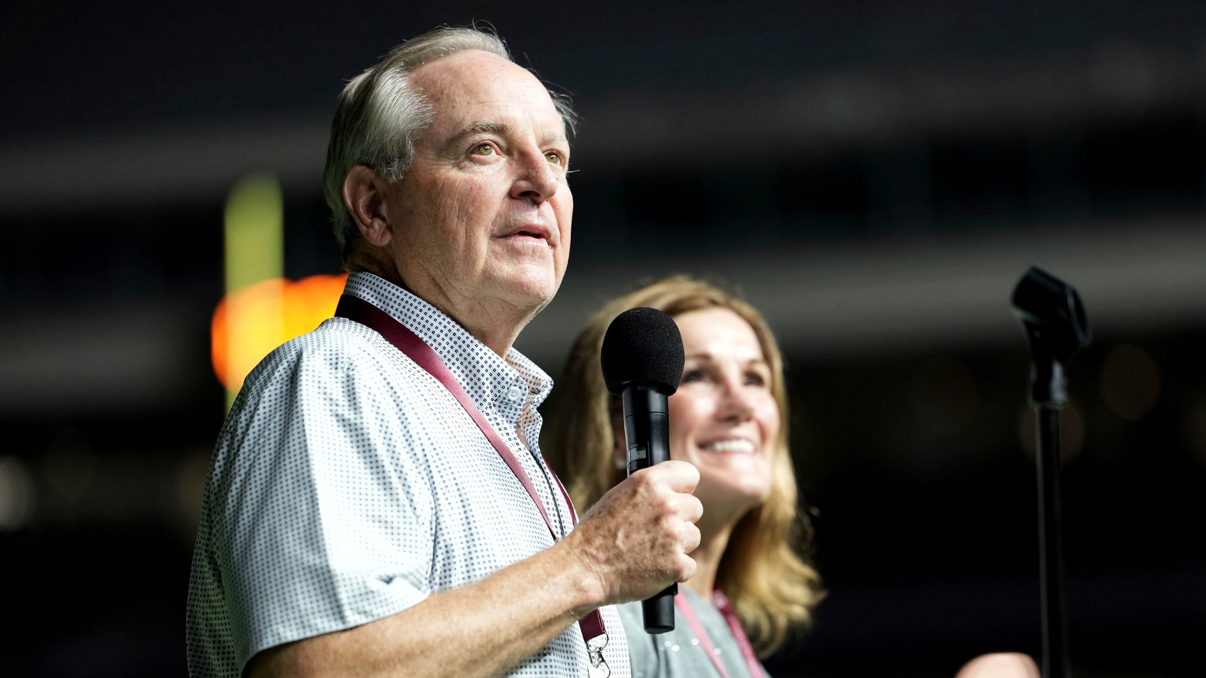 Texas A&M University President Mark A. Welsh, left, addresses the crowd inside Kyle Field as his wife Betty looks on during Midnight Yell in College Station, Texas, Saturday, Aug. 30, 2025. (AP Photo/Sam Craft, File)
