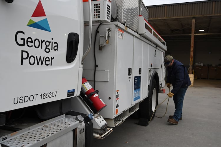 Austin Brown, with Georgia Power, prepares his truck at Georgia Power North Shallowford Operating Headquarters, Saturday, Jan. 24, 2026, in Atlanta. In metro Atlanta, an ice storm warning went into effect at 1 p.m. Saturday. It’s expected to last until Monday morning, the National Weather Service said. (Hyosub Shin/AJC)