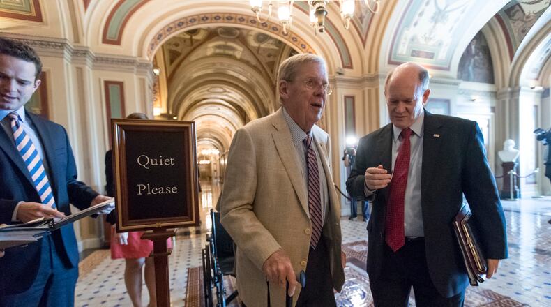 Sen. Johnny Isakson, R-Ga., left, and Sen. Chris Coons, D-Del., members of the Senate Foreign Relations Committee, arrive on Capitol Hill on last week. AP/J. Scott Applewhite