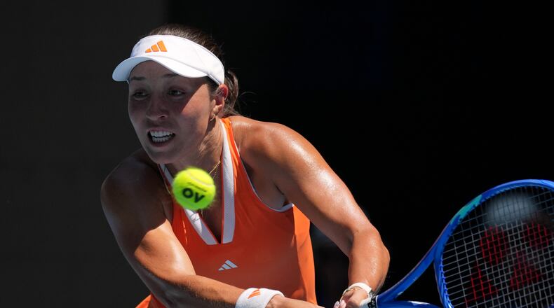 Jessica Pegula of the U.S. plays a backhand return to her compatriot Madison Keys during their fourth round match at the Australian Open tennis championship in Melbourne, Australia, Monday, Jan. 26, 2026. (AP Photo/Mark Baker)