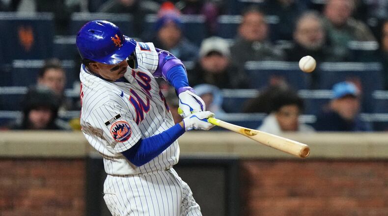 New York Mets' Mark Vientos hits an RBI single during the eighth inning of a baseball game against the Minnesota Twins Wednesday, April 22, 2026, in New York. (AP Photo/Frank Franklin II)