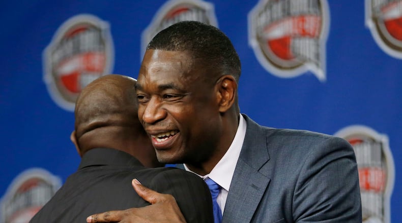 Former NBA basketball player Dikembe Mutombo, right, hugs former player Spencer Haywood after they were announced as part of the 12 finalists of this year’s hall of fame class during an event ahead of the NBA All Star basketball game, Friday, Feb. 13, 2015, in New York. (AP Photo/Julio Cortez)