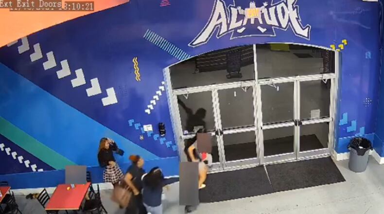 Gwinnett County police shared security video they say shows Starlita Moore and her adult daughter, Teisha Schulters, exiting a trampoline park at Sugarloaf Mills as two state employees try to stop them. Police blurred out the children in the video before sharing it.