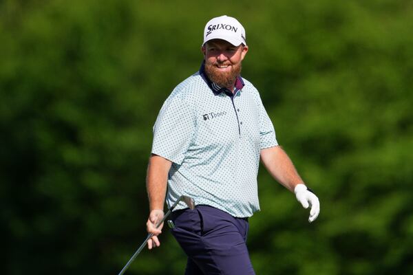 Shane Lowry, of Ireland, smiles on the 12th hole during the third round at the Masters golf tournament, Saturday, April 12, 2025, in Augusta, Ga. (AP Photo/Matt Slocum)