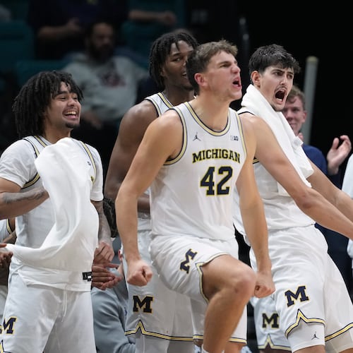 Michigan celebrates as they defeat Gonzaga in an NCAA college basketball game in the Players Era tournament in Las Vegas, Wednesday, Nov. 26, 2025. (AP Photo/Eric Gay)