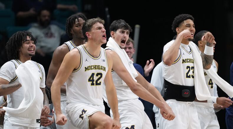 Michigan celebrates as they defeat Gonzaga in an NCAA college basketball game in the Players Era tournament in Las Vegas, Wednesday, Nov. 26, 2025. (AP Photo/Eric Gay)