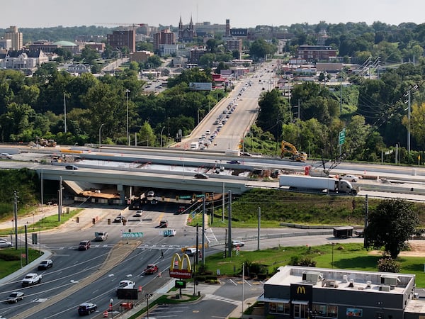 Downtown Macon seen here in the background overlooking I-16's under-construction Spring Street exit along the Ocmulgee River. (Hyosub Shin / AJC)