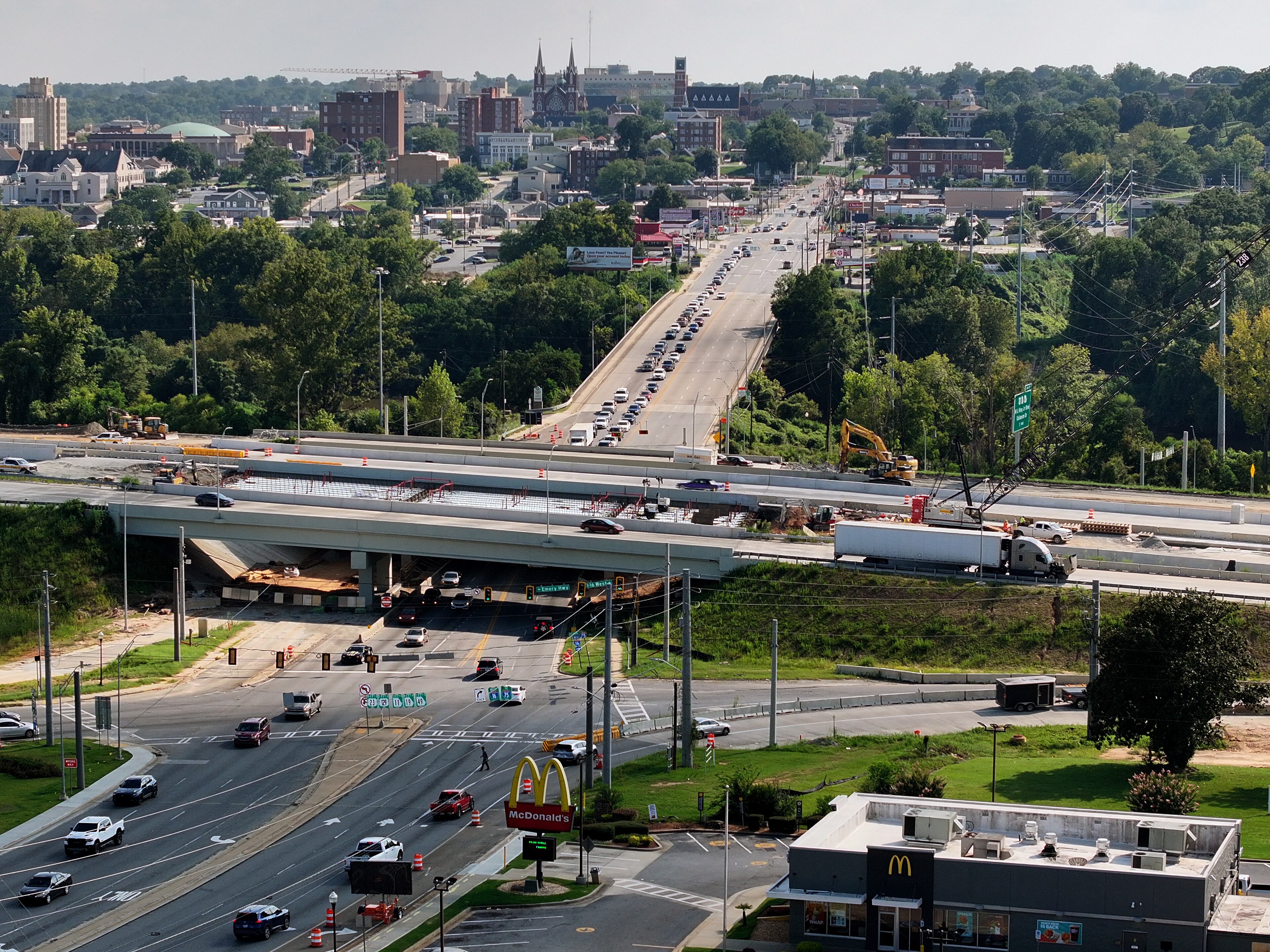 Downtown Macon seen here in the background overlooking I-16's under-construction Spring Street exit along the Ocmulgee River. (Hyosub Shin / AJC)