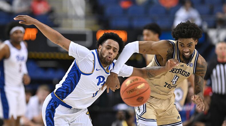 Pitt's Nelly Cummings battles Georgia Tech's Ja'von Franklin during the second half of their game in the second round of the ACC Tournament. (Grant Halverson/TNS)