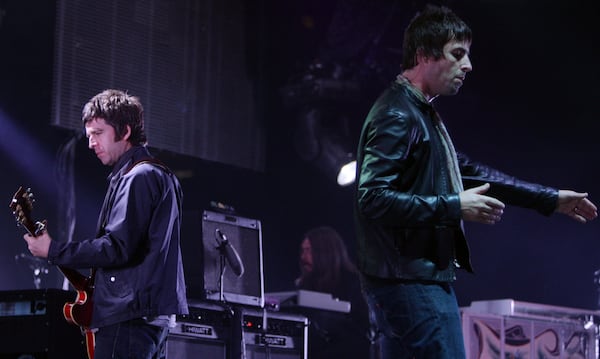 FILE - Noel, left, and Liam Gallagher, of Oasis, perform in Vancouver, B.C., on Aug. 27, 2008. (Darryl Dyck/The Canadian Press via AP, File)