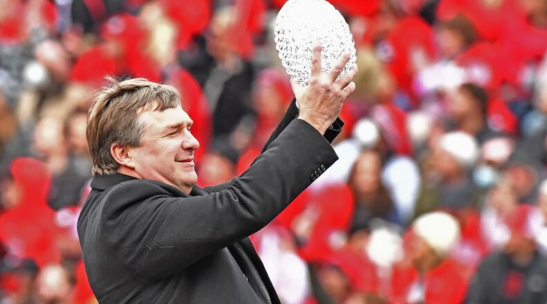 Georgia head coach Kirby Smart holds up The Coaches’ Trophy during the celebration of Georgia’s College Football Playoff national championship at Sanford Stadium in Athens on Saturday, January 15, 2022. Georgia captured the national championship, its first since the 1980 season, with a 33-18 victory over Alabama at Lucas Oil Stadium in Indianapolis. (Hyosub Shin / Hyosub.Shin@ajc.com)