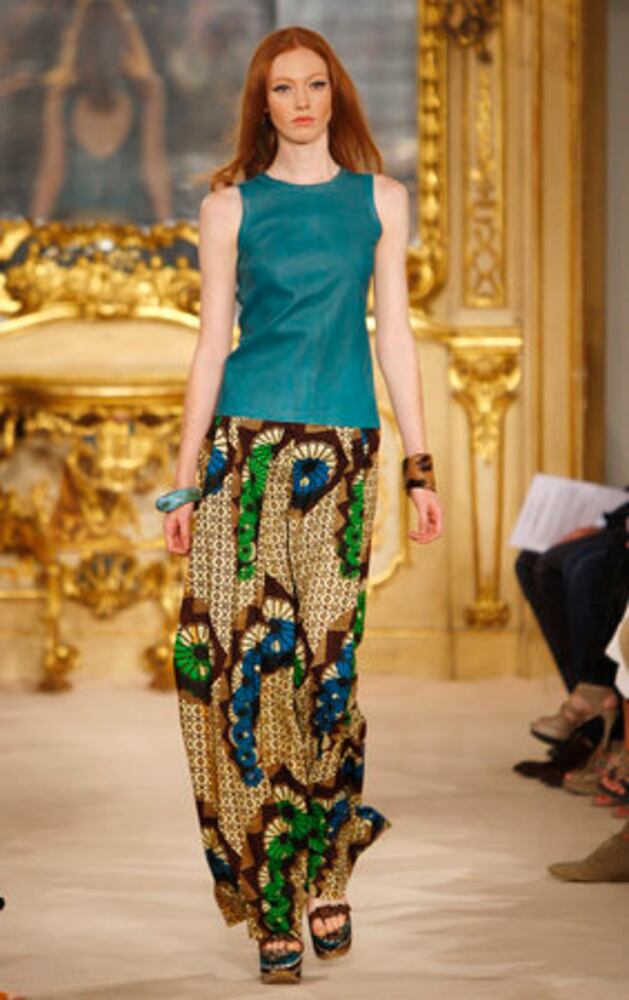 Models take the catwalk during Milan Fashion Week 2011