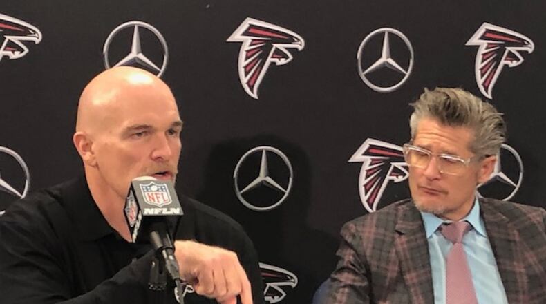 Dan Quinn and Thomas Dimitoff at the end of the year press conference. (By D. Orlando Ledbetter/dledbetter@ajc.com)