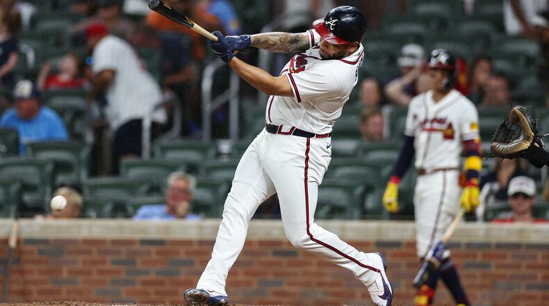 The Braves' Dominic Smith hits an RBI single in the eighth inning Wednesday, July 22, 2026, against the Padres in Atlanta. Smith had a three-run home run in the fourth inning Thursday that gave the Braves a 5-3 lead en route to their 6-5 victory. (Colin Hubbard/AP)