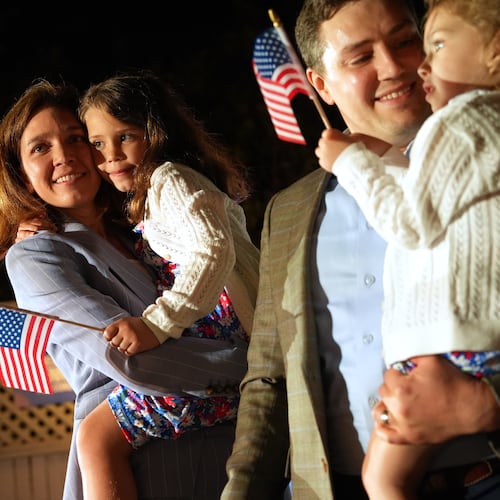 From left, Rebecca Bennett, Democratic candidate for New Jersey's 7th Congressional District, holds her daughter Rosie, alongside her husband Alex Hydrean and daughter Millie during a primary election night watch party after winning the Democratic nomination Tuesday, June 2, 2026, in Bridgewater, N.J. (AP Photo/Ryan Murphy)