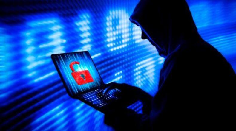 The Justice Department has charged three North Korean computer programmers in a broad range of global hacks, including a destructive attack targeting an American movie studio, and in the attempted theft and extortion of more than $1.3 billion from banks and companies, federal prosecutors said Wednesday. (AJC file photo)