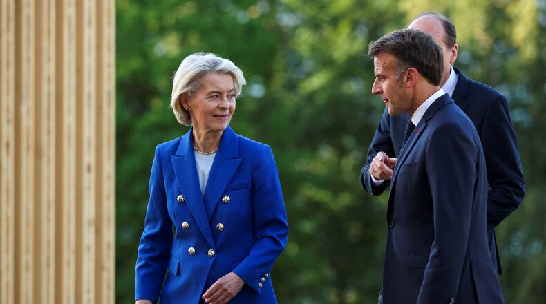 French President Emmanuel Macron walks with European Commission President Ursula von der Leyen during the G7 summit in Evian-les-Bains, France, Monday, June 15, 2026. (Isabel Infantes/Pool Photo via AP)