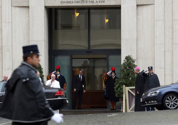 FILE - Pope Francis waves to faithful as he arrives at Vatican's Santa Marta hotel where the Pontiff has his apartment, at the Vatican, March 28, 2013. (AP Photo/Gregorio Borgia, File)