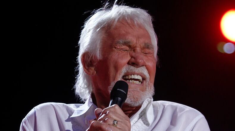 FILE - In this June 9, 2012, file photo, Kenny Rogers performs at the 2012 CMA Music Festival in Nashville, Tenn. Actor-singer Kenny Rogers, the smooth, Grammy-winning balladeer who spanned jazz, folk, country and pop with such hits as âLucille,â âLadyâ and âIslands in the Streamâ and embraced his persona as âThe Gamblerâ on record and on TV died Friday night, March 20, 2020. He was 81. (Photo by Wade Payne/Invision/AP, File)