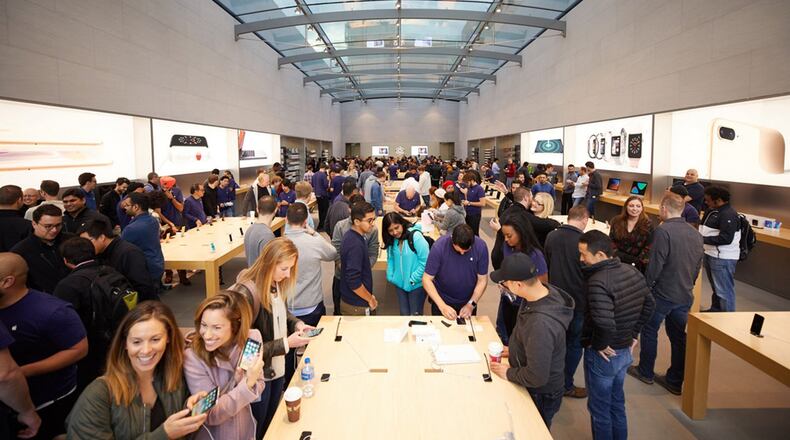 Customers are introduced to the iPhone X at the Apple Palo Alto store. (Apple Inc.)