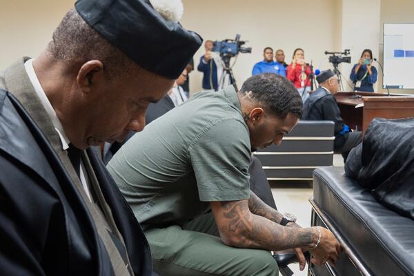 Tampa Bay Rays shortstop Wander Franco, right, reacts during his trial on charges of sexual abuse of a minor, in Puerto Plata, Dominican Republic, Thursday, June 26, 2025. (AP Photo/Fran Afonso)