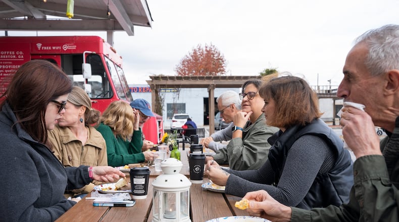 Refuge Coffee Co., a nonprofit that provides barista jobs for refugees, hosts its eighth annual "Friendsgiving," on Nov. 20 in Clarkston, Ga. Friendsgiving is a laidback event for communities from all over the world to come together and celebrate friendship over homemade favorite international dishes. (Olivia Bowdoin for the Atlanta Journal-Constitution).