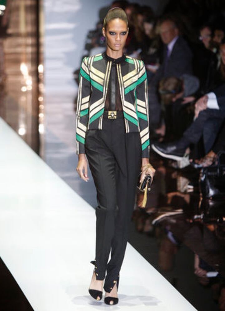 Models take the catwalk during Milan Fashion Week 2011