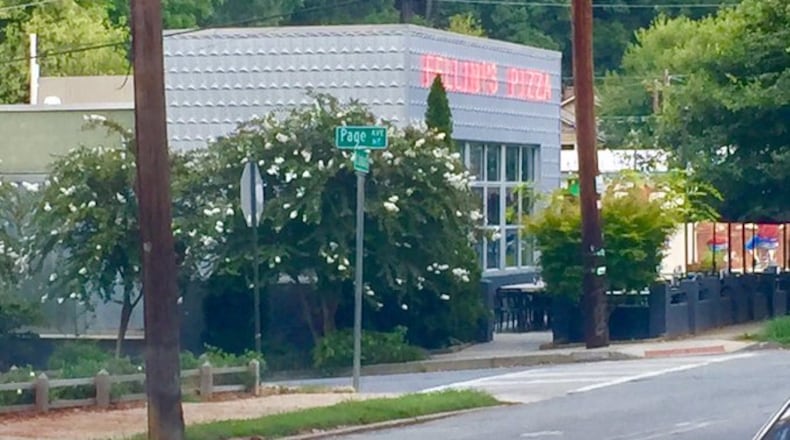 Two robbers held Fellini's Pizza employees at gunpoint, according to police.