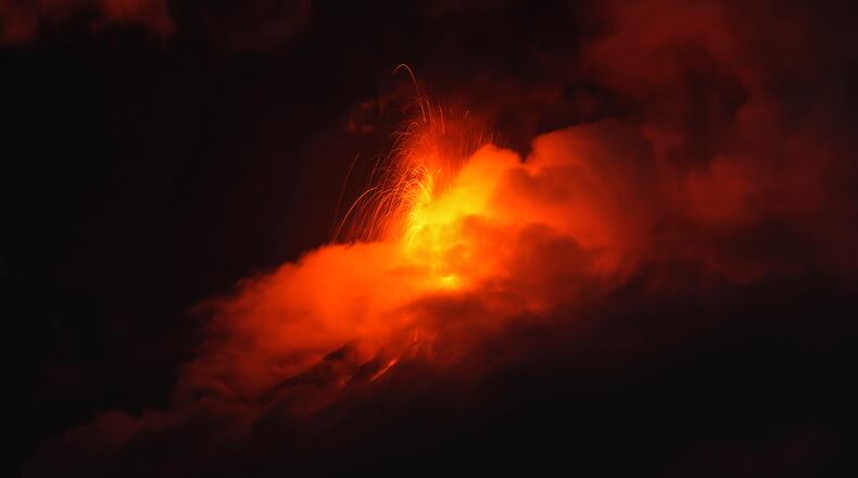 Lava flows out of the crater of the Fuego Volcano, as seen from San Juan Alotenango, Guatemala, Tuesday, Aug. 4, 2026. (AP Photo/Moises Castillo)