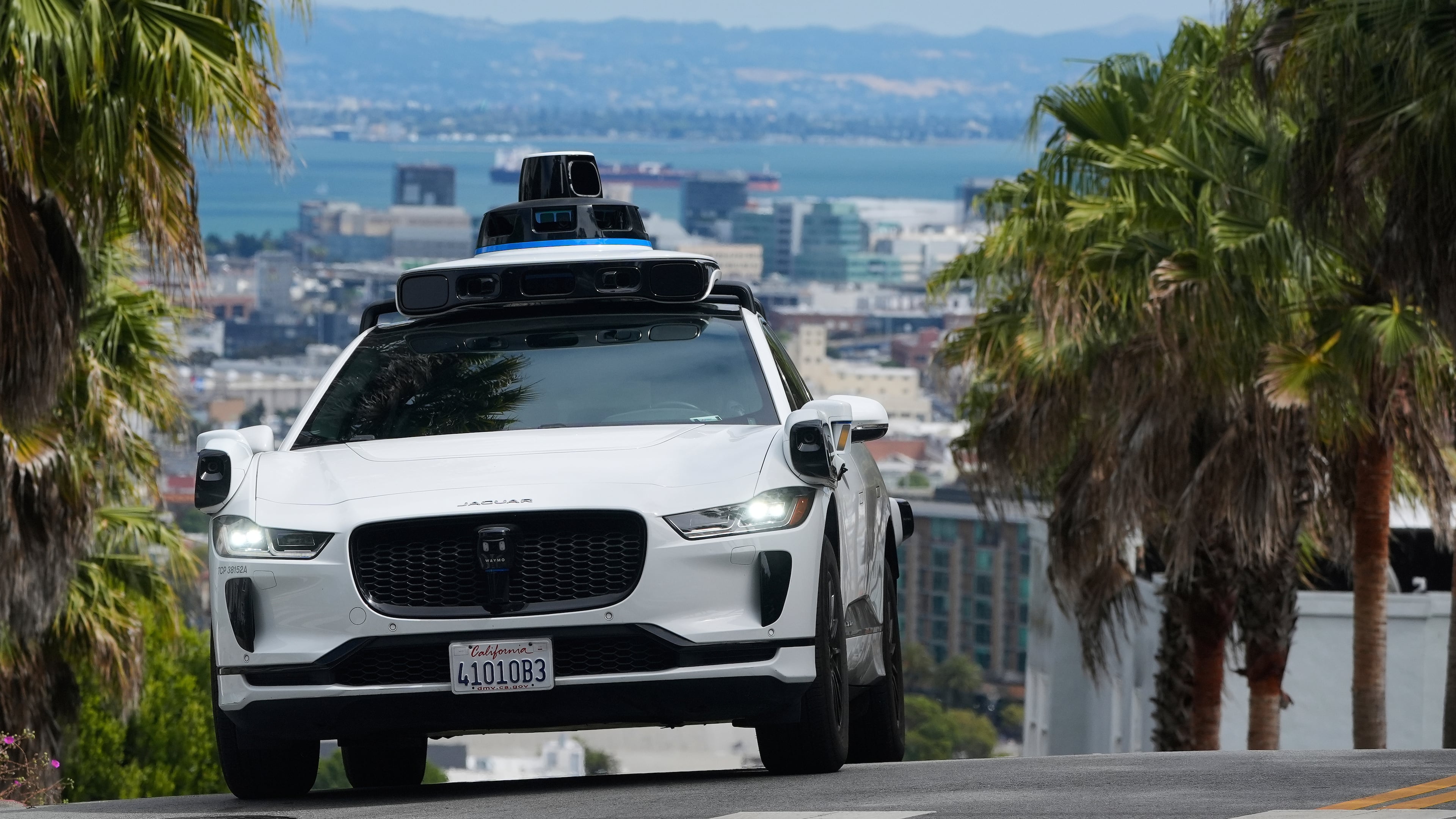 FILE - A Waymo car drives up a hill in San Francisco, Sept. 4, 2025. (AP Photo/Jeff Chiu, File)