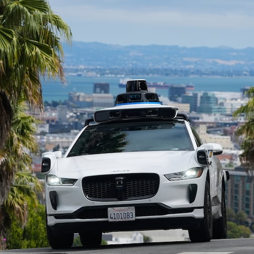 FILE - A Waymo car drives up a hill in San Francisco, Sept. 4, 2025. (AP Photo/Jeff Chiu, File)