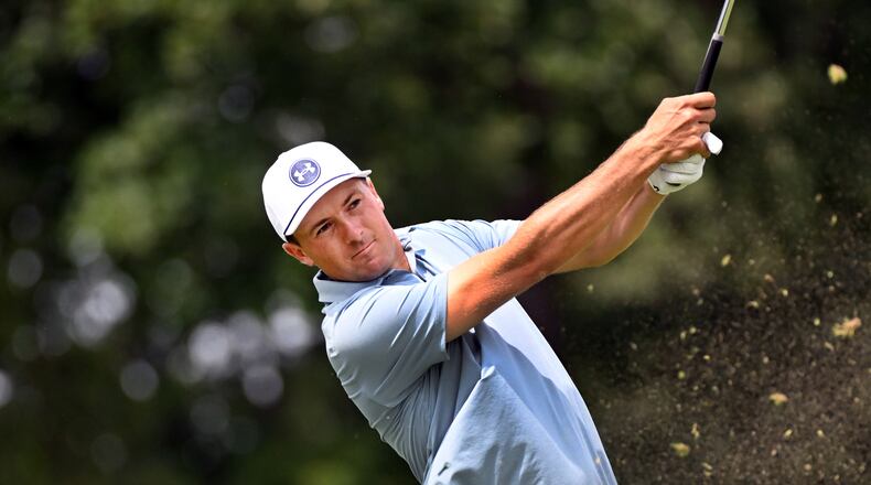 Jordan Spieth hits from the ninth tee during the first round of the Rocket Classic golf tournament at the Detroit Golf Club, Thursday, July 30, 2026, in Detroit. (AP Photo/Jose Juarez)
