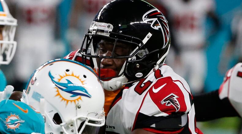 Atlanta Falcons cornerback Damontae Kazee (27) tackles Miami Dolphins wide receiver Jakeem Grant (19), during the first half of an NFL preseason football game, Thursday, Aug. 10, 2017, in Miami Gardens, Fla. (AP Photo/Wilfredo Lee)
