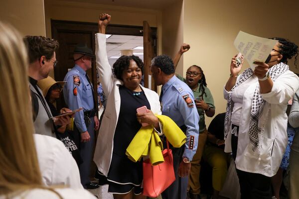 Dr. Karenne Fru, an Atlanta-based Reproductive Endocrinologist, reacts as she leaves the committee meeting after she spoke in opposition to House Bill 441 wait at the Georgia State Capitol, Wednesday, March, 26, 2025, in Atlanta. The bill will make all abortion illegal and criminalize women who get abortions. (Jason Getz / AJC)