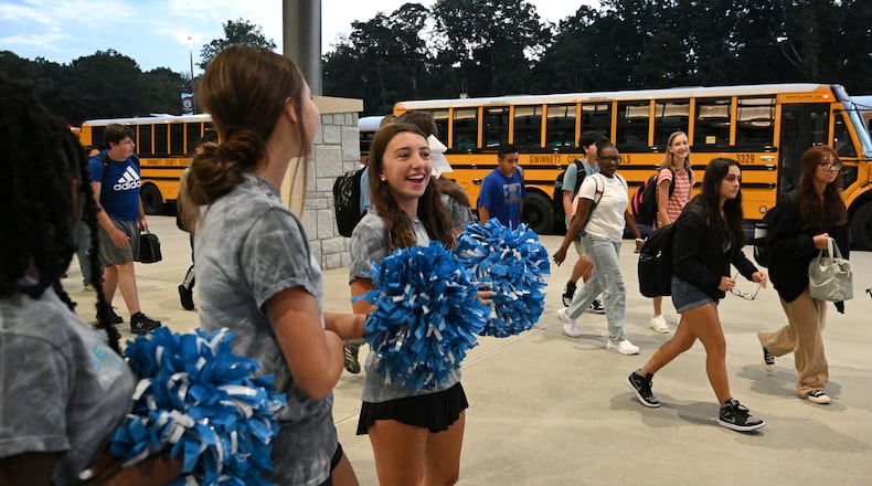 Ninth grade students arrive for the first day of school at Seckinger High School in Gwinnett County on Wednesday, Aug. 3, 2022. State lawmakers are discussing changes to Georgia's education funding formula. Some speakers, including a former Gwinnett student, have suggested at public hearings more funding for transportation. (Hyosub Shin / Hyosub.Shin@ajc.com)