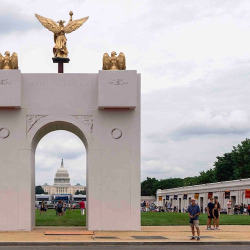 FILE - A mockup of President Donald Trump's proposed triumphal arch stands at the Great American State Fair on the National Mall, June 27, 2026, in Washington. (AP Photo/Jen Golbeck, File)
