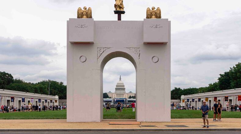 FILE - A mockup of President Donald Trump's proposed triumphal arch stands at the Great American State Fair on the National Mall, June 27, 2026, in Washington. (AP Photo/Jen Golbeck, File)