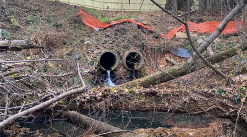 The existing stormwater pipe adjacent to Old Alabama Road in Johns Creek has no headwall. Without a headwall to properly handle the velocity of the water exiting the pipe, the ground under and around the pipe has become heavily eroded. (Courtesy City of Johns Creek)
