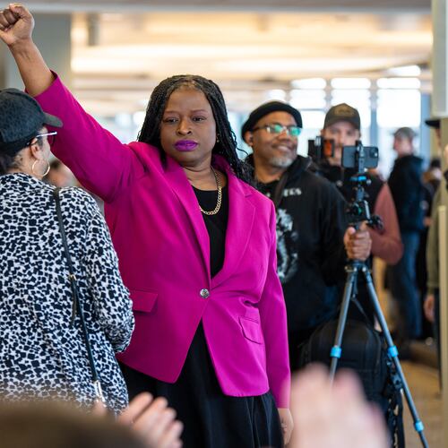 FILE - Nekima Levy Armstrong holds up her fist after speaking at an anti-ICE rally for Martin Luther King Jr., Monday, Jan. 19, 2026, in St. Paul, Minn. (AP Photo/Angelina Katsanis, File)