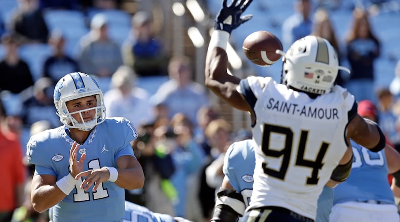 North Carolina quarterback Nathan Elliott (11) has a pass blocked by Georgia Tech's Anree Saint-Amour (94) during the first half of an NCAA college football game in Chapel Hill, N.C., Saturday, Nov. 3, 2018. (AP Photo/Gerry Broome)