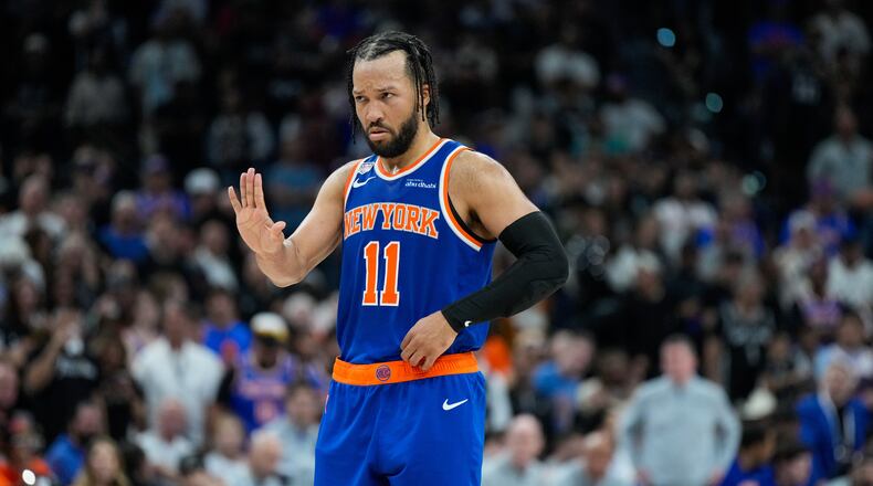 New York Knicks guard Jalen Brunson motions to teammates during the second half of Game 5 of the NBA Finals basketball series against the San Antonio Spurs, Saturday, June 13, 2026, in San Antonio. (AP Photo/Ross D. Franklin)