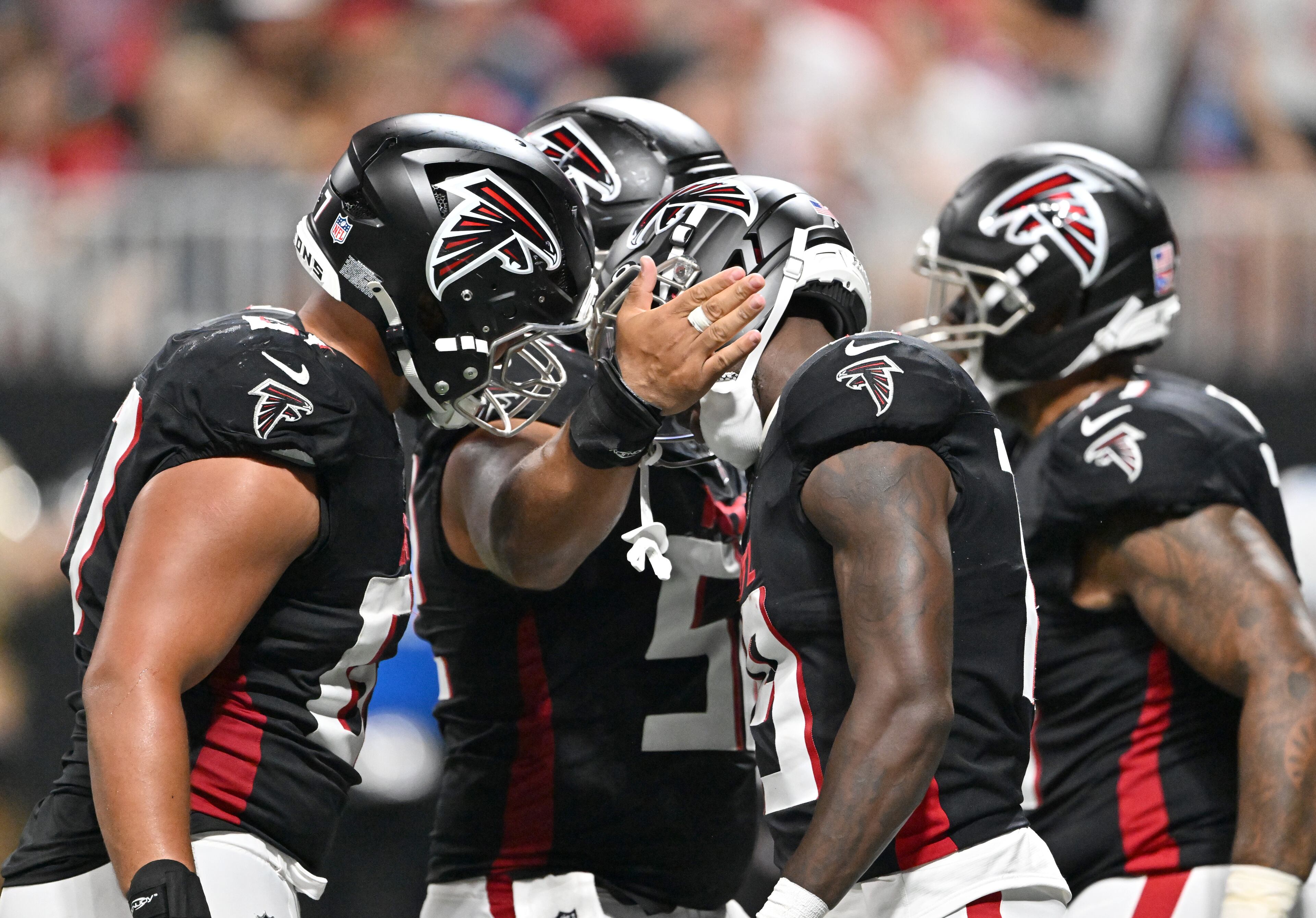 Falcons wide receiver Chris Blair (center) celebrates with teammates after scoring a touchdown during an NFL preseason game at Mercedes-Benz Stadium on Friday, Aug. 15, 2025, in Atlanta. (Hyosub Shin/AJC)