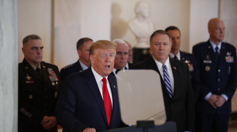 President Donald Trump addresses the nation Wednesday from the White House to discuss the ballistic missile strike that Iran launched against Iraqi air bases housing U.S. troops. Vice President Mike Pence, Secretary of State Mike Pompeo and military leaders look on. (AP Photo/Alex Brandon)