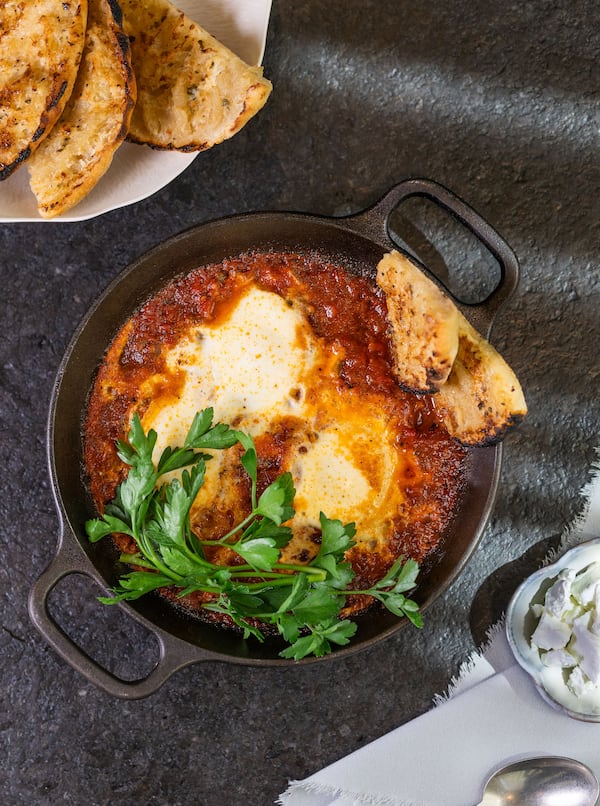 Rumi’s Kitchen shakshuka poaches an egg in shakshuka sauce (Courtesy of Rumi's Kitchen)