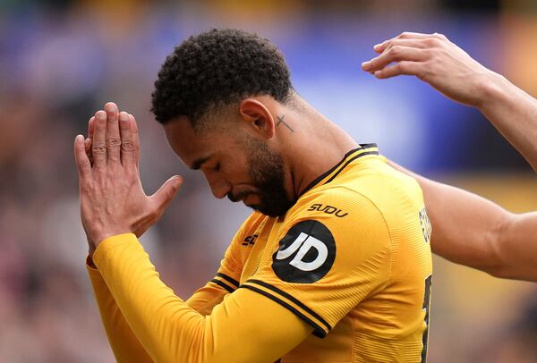 Wolverhampton Wanderers' Matheus Cunha celebrates scoring their side's fourth goal of the game during the English Premier League soccer match between Wolverhampton and Tottenham Hotspur at Molineux Stadium in Wolverhampton, England, Sunday, April 13, 2025. (Jacob King/PA via AP)
