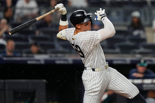 New York Yankees' Aaron Judge (99) swings during the eighth inning of a baseball game against the Seattle Mariners, Wednesday, July 9, 2025, in New York. (AP Photo/Yuki Iwamura)