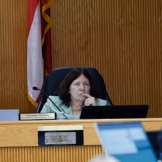 State Election Board Member Carolyn Roddy listens during the State Elections Board meeting at the Fayette County Administration Complex on Wednesday, Aug. 19, 2026. She has circulated a resolution urging upgrades to Georgia's voting system with assistance "from any quarter." (Miguel Martinez/AJC)